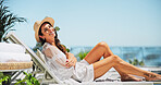 Woman, sunbathing and portrait with vacation, smile and relax for trip, break and travel. Luxury resort, peace and girl with deck chair, adventure and carefree for hotel accommodation or hospitality