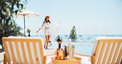 Buy stock photo Woman, dance and swimming pool with vacation, view and excited for trip, break and travel. Luxury resort, peace and girl with smile, adventure and carefree for hotel accommodation or hospitality