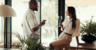 Buy stock photo Interracial, couple and smile with wine at house on Valentines day, celebration and anniversary date. People, alcohol and laughing for funny joke, marriage commitment and love with bonding of romance
