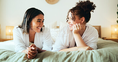Buy stock photo Sleepover, happy friends and girls relax in bedroom for bonding, talk or gossip story. Bed, women and together in luxury hotel for rest, holiday or communication at social hangout for slumber fun