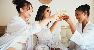 Buy stock photo Women, friends and toast drinks at spa, bed and happy for reunion, bonding and alcohol at resort. People, girl and group with champagne, glass or celebration with cheers in hotel room on holiday