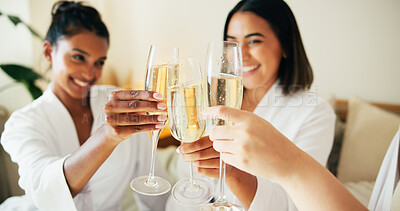 Buy stock photo Hands, friends and champagne for toast at spa, relax and happy for reunion, bonding or diversity at resort. People, girl and group with glasses, drinks or alcohol for cheers in hotel room on vacation