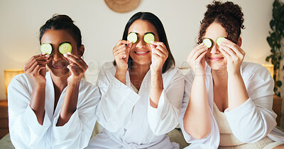 Buy stock photo Cucumber, skincare and smile with friends in bedroom for beauty, spa day and dermatology. Facial, natural cosmetics treatment and hotel resort with women for self care, luxury and relax together