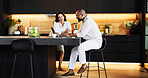 Planning, laptop and online with interracial couple in kitchen for travel itinerary, flight booking or vacation package. Passport application, discussion and airline review with man and woman at home
