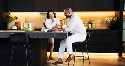 Buy stock photo Planning, laptop and online with interracial couple in kitchen for travel itinerary, flight booking or vacation package. Passport application, discussion and airline review with man and woman at home