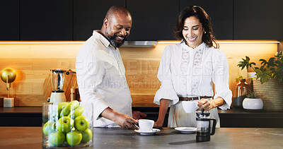 Buy stock photo Interracial, couple and relax with coffee in kitchen for caffeine start, morning routine and bonding together. Mature, people and warm beverage with laughing, funny discussion and commitment at house