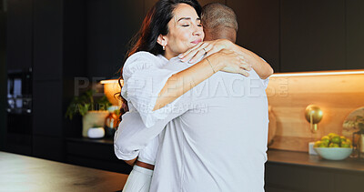 Buy stock photo Hug, love and mature interracial couple in kitchen with home, bonding and marriage or romance. Safety, security and trust with man, woman and embrace in modern apartment for anniversary celebration
