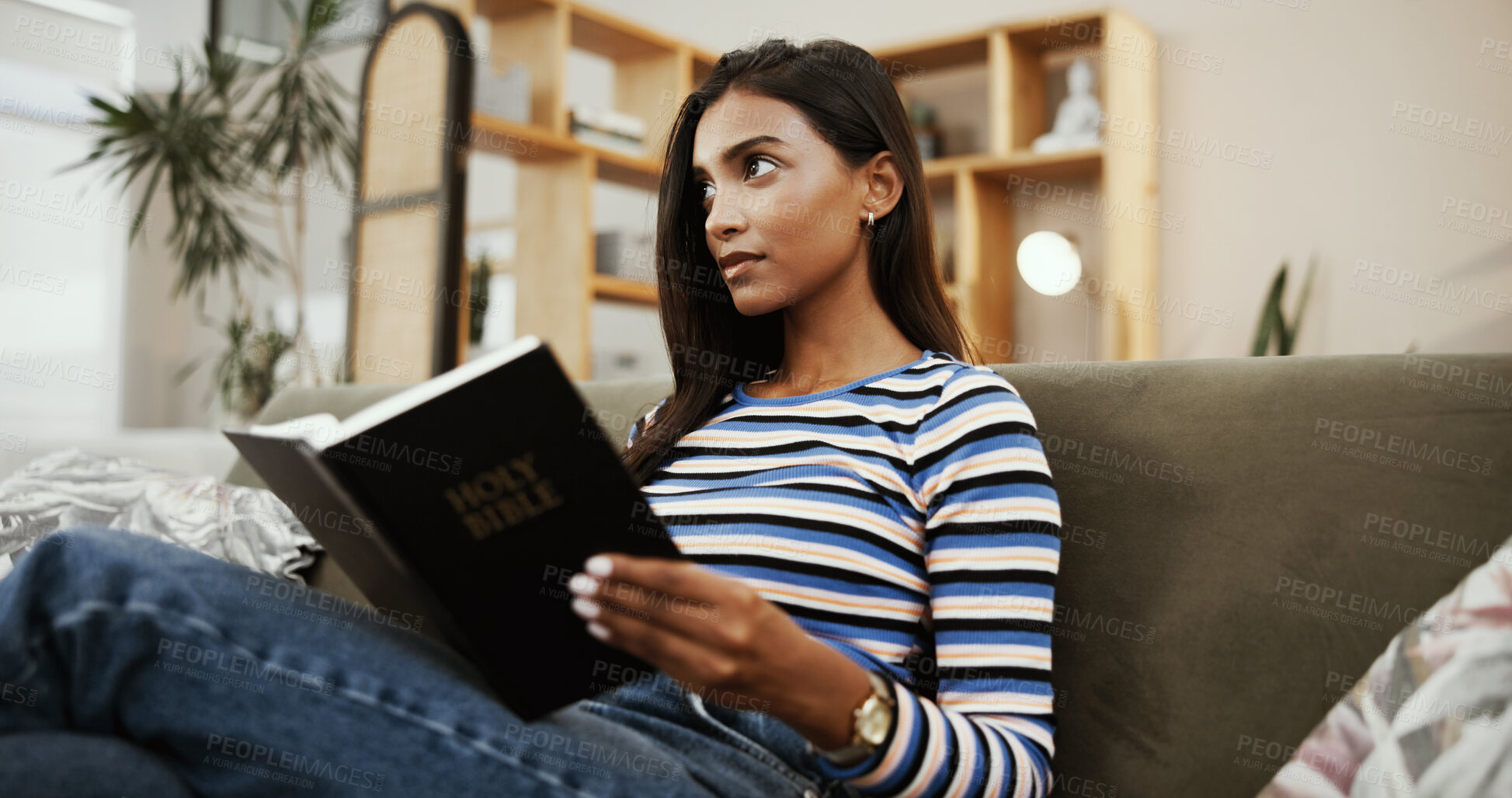 Buy stock photo Woman, bible and thinking with religion on sofa in home for reading, knowledge or scripture for spiritual guide. Person, girl and Christian book with faith, learning and wisdom in gospel at apartment