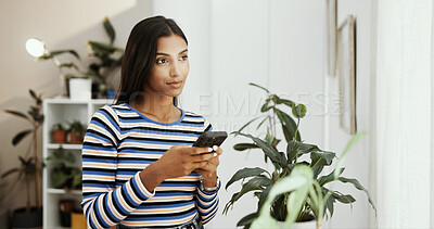 Buy stock photo Thinking, student or Indian woman in home with phone for texting, social media or college portal. Dream job, ideas and girl on mobile for university website, scholarship results or online application
