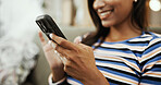 Phone, home and hands of woman on sofa for online chatting, social media and internet on weekend. Relax, happy and person on smartphone for mobile app, notification and communication in living room