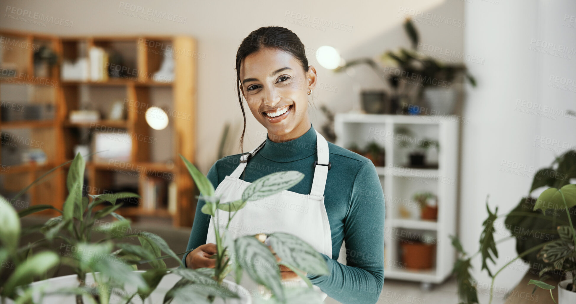 Buy stock photo Woman, plant care and smile in home, portrait or chores for spray bottle, growth and excited in living room. Girl, person and happy in lounge with water, leaves or fertilizer at apartment in Malaysia