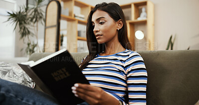 Buy stock photo Woman, bible study and religion on sofa in home for reading, knowledge and holy scripture for spiritual guide. Person, girl and Christian book with faith, learning and wisdom in gospel at apartment