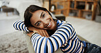 Woman, smile and portrait on sofa in home with pride in morning, confidence and relax in living room. Girl, person and happy on couch, comfort and weekend for break in lounge at apartment in Malaysia