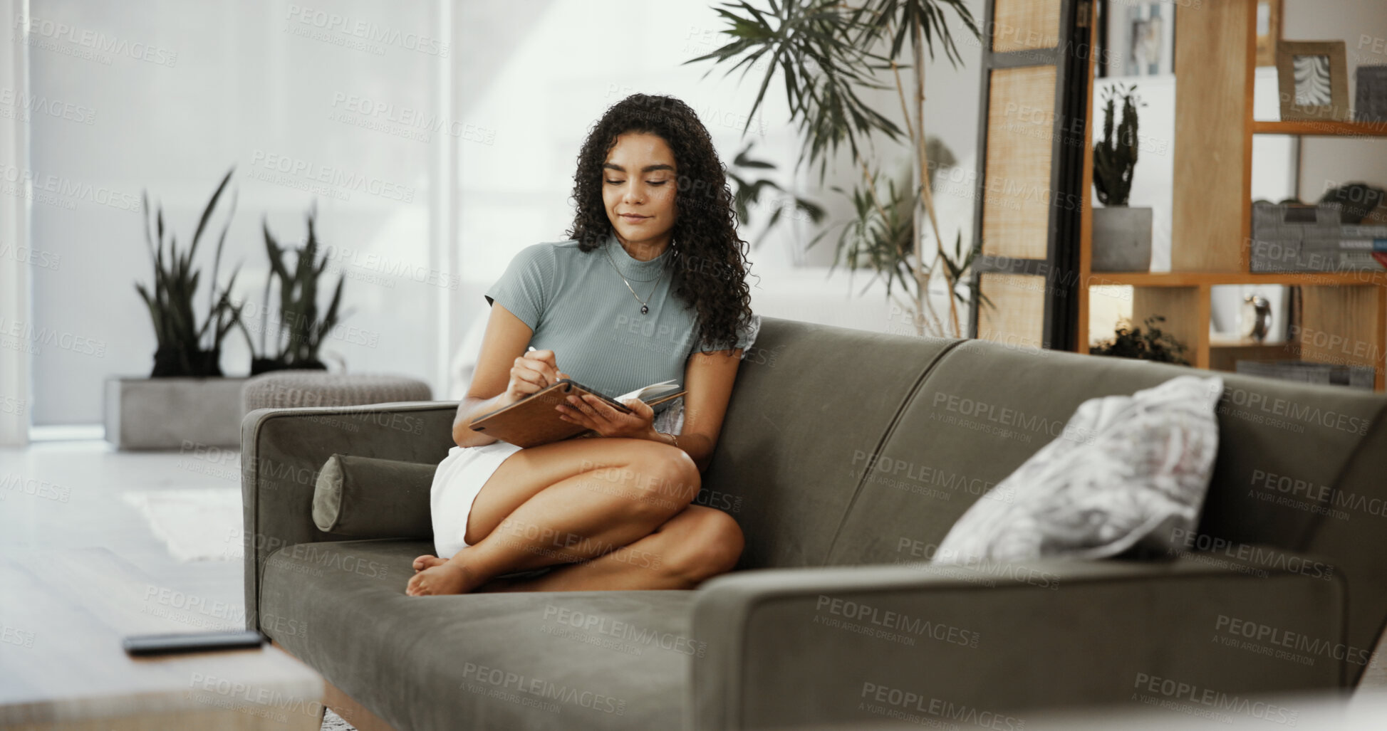 Buy stock photo Woman, journal and writing ideas in home, self care and positive affirmations for gratitude goals. Couch, schedule reminder and diary notes with inspiration for future, brainstorming and reflection