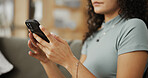 Hands, phone and texting on sofa in home with search, scroll and contact with web chat in living room. Person, smartphone and relax on mobile app, notification and typing on social media at apartment