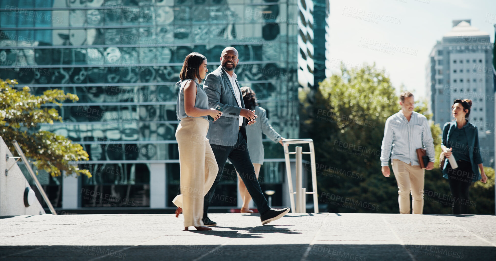 Buy stock photo Business, employees and walking in city with discussion for corporate ideas, campaign planning and urban commute. Professional, people and morning journey to appointment, meeting or career conference