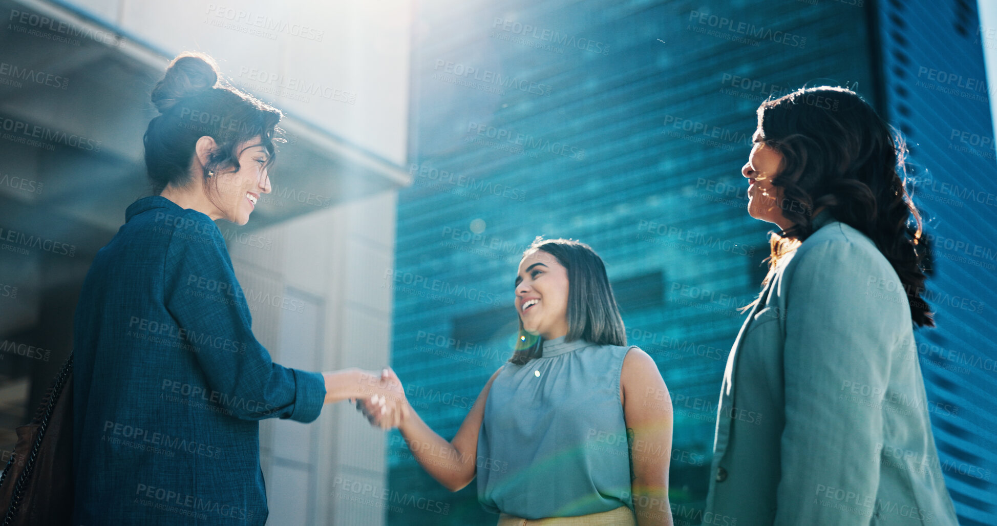 Buy stock photo Business, women and meeting with handshake in city for introduction, greeting or hiring. Female people, group or happy employees shaking hands with smile for corporate recruiting, agreement or deal