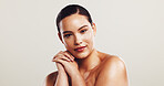 Woman, portrait and proud for skincare in studio of natural beauty, facial treatment and dermatology. Female person, confident and cosmetics for self care, shine results and space on white background