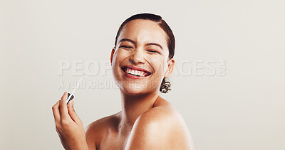 Buy stock photo Smile, woman and serum for skincare in studio of facial treatment, collagen benefits and dermatology. Person, laughing and oil product for self care, hyaluronic acid and hydration on white background