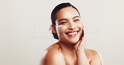 Buy stock photo Smile, woman and lotion with skincare in studio of facial hydration, repair skin and treatment benefits. Happy, person and cream product with dermatology glow, anti aging results and white background