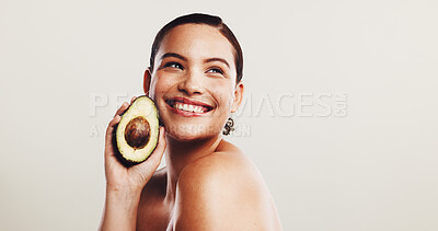 Buy stock photo Avocado, skincare and woman in studio with natural, organic and moisturizing face routine. Beauty, dermatology and female person with fruit for facial elasticity and glow by white background.