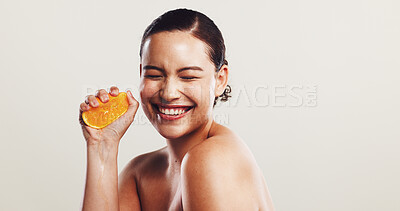 Buy stock photo Happy woman, orange or squeeze with vitamin C for detox, skincare or nutrition on a white studio background. Female person, model or smile with natural organic fruit for healthy antioxidant on space