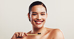 Happy woman, portrait and bamboo with toothbrush for dental hygiene on a white studio background. Face, female person or model with smile or teeth for fresh breath, oral or mouth care on mockup space