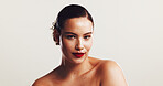 Woman, portrait and makeup with lipstick in studio, cosmetics and confidence by mockup space. Calm, female person and model with smooth change for beauty, treatment and wellness by white background