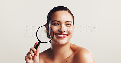 Buy stock photo Portrait, magnifying glass and woman in studio, skincare and wellness on white background. Face, happy person and model with smile, beauty and inspection for dermatology, check for wrinkles and acne