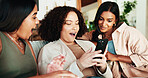 Women, friends and phone with shock for online dating, social media or joke with meme in living room. Happy people, support and gossip for bonding, blog post and memories in home lounge for reunion