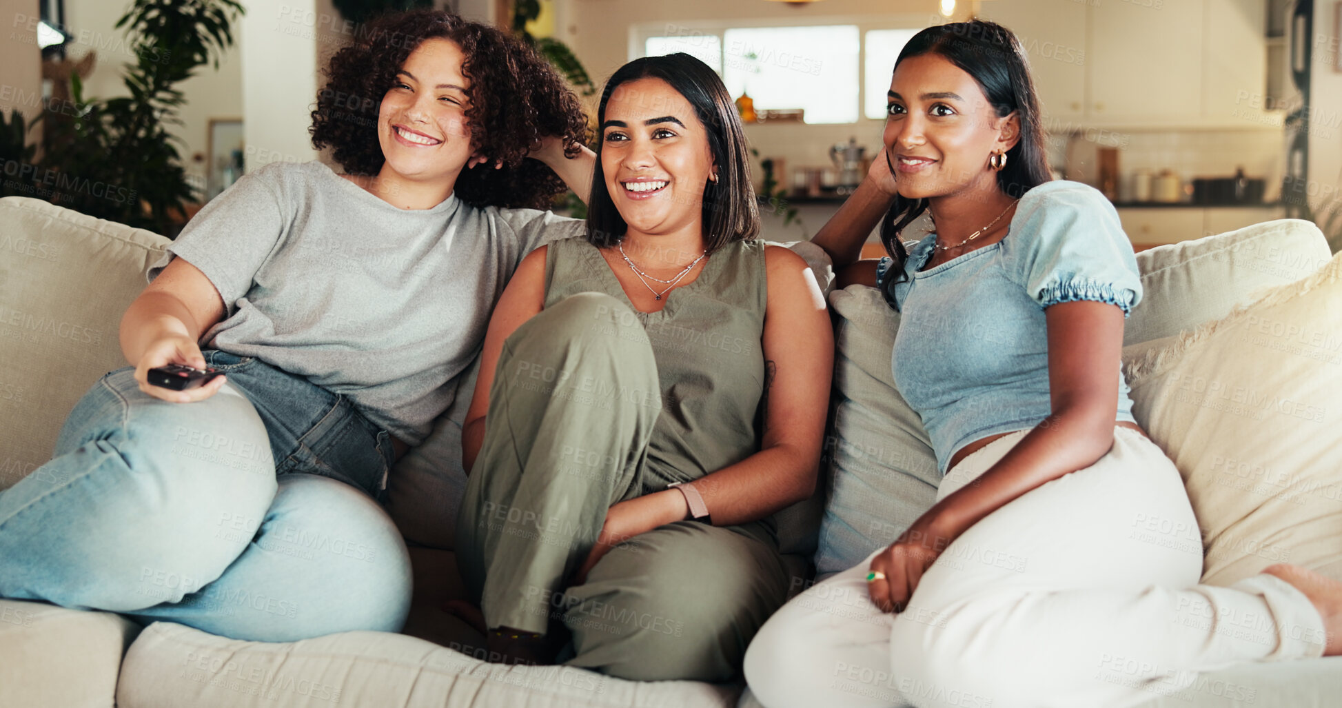 Buy stock photo Woman, friends and smile watching tv, movies and bonding in living room with remote. People, reunion and television for entertainment, conversation or discussion for communication on couch with joke