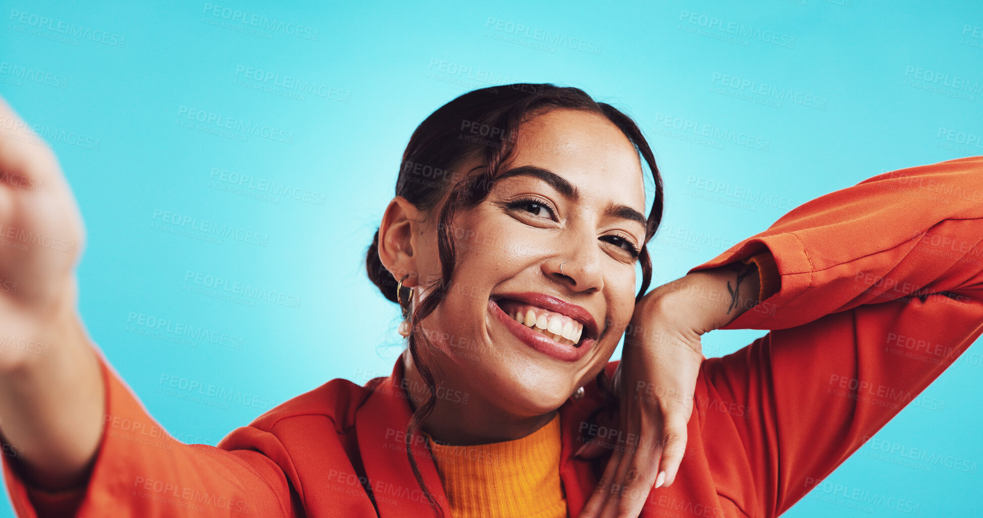 Buy stock photo Selfie, happy and portrait of woman on blue background with smile for social media, profile picture or memory. Photography, influencer and face of girl with confidence, pride or online post in studio