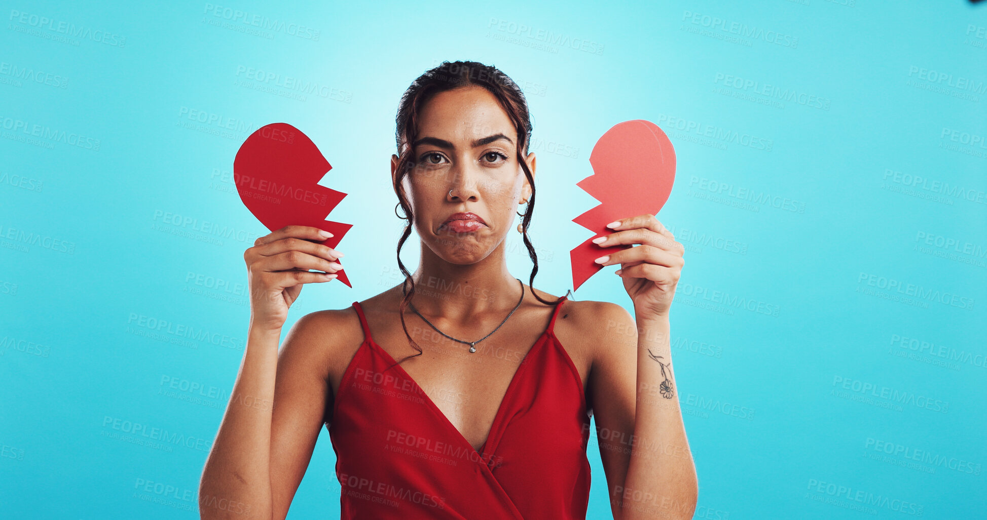 Buy stock photo Heartbreak, sad and woman with paper heart, studio or girl with failed relationship or mockup space. Blue background, portrait and breakup on valentines day, ripped and disappointed on date or person