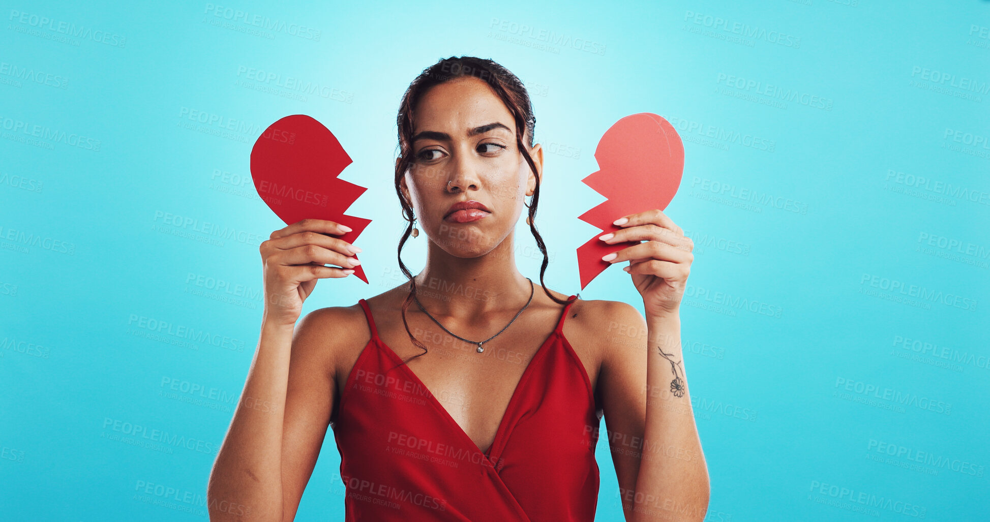 Buy stock photo Heartbreak, depressed and woman with paper heart, studio and girl with failed relationship and mockup space. Blue background, thinking and breakup on valentines day, ripped and sad person on date