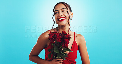 Buy stock photo Woman, red roses and happy for valentines day in studio, portrait or gift for celebration for love by blue background. Girl, person and excited for smile, bouquet or flowers for present in Costa Rica