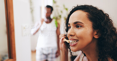 Buy stock photo Bathroom, brushing teeth and woman with toothbrush in home for dental care, mouth hygiene and cleaning. Health, morning routine and couple with toothpaste for oral wellness, fresh and grooming