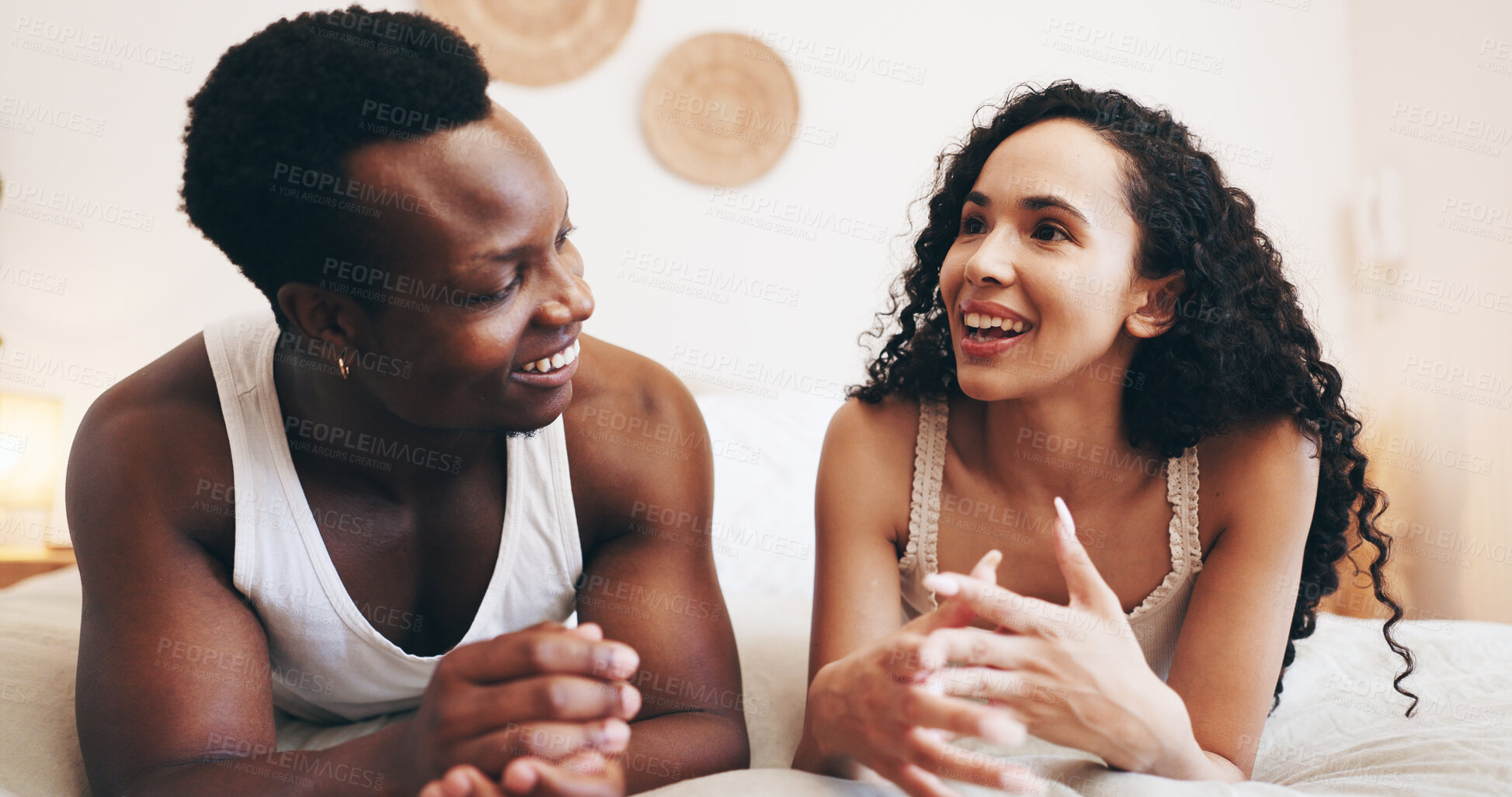 Buy stock photo Talking, happy and couple in bedroom in morning for relaxing, conversation and bonding in hotel. Marriage, relationship and man with woman on bed for affection, commitment and valentines day