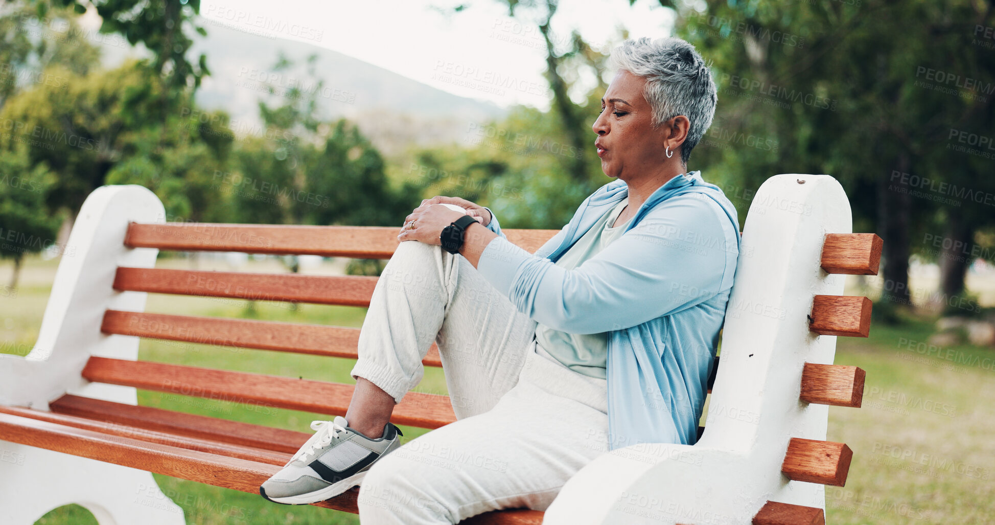 Buy stock photo Knee pain, fitness and mature woman in park with injury, muscle strain and inflammation on bench. Nature, sports and senior person with accident for exercise, workout and walking outdoors for health