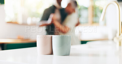 Buy stock photo Morning, coffee and mug of couple in kitchen for caffeine beverage, warm drink and cappuccino. Marriage, home and man and woman dance, bonding and embrace with cups on counter for breakfast together