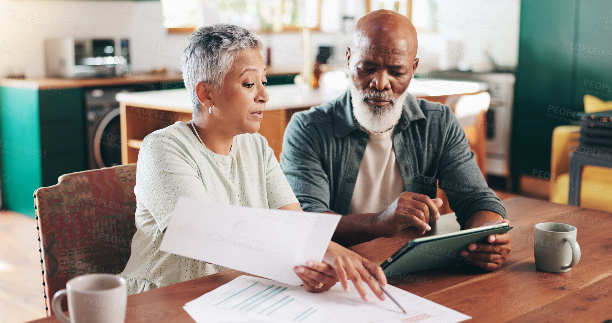 Buy stock photo Mature, interracial couple and documents with tablet for payment due, financial planning or expenses at home. Man, woman or mortgage with paperwork or technology for finance, budget or bills at house