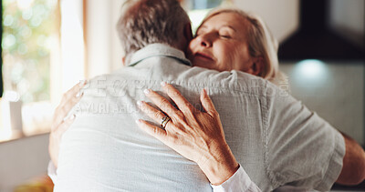 Buy stock photo Senior couple, hug and bonding in home, love and enjoying reunion with happy wife in kitchen. Elderly people, romance and support to connect for healthy marriage, commitment and retirement embrace
