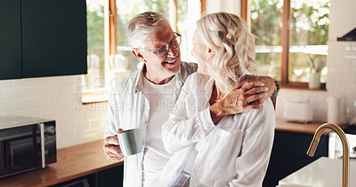 Buy stock photo Senior couple, hug and coffee in home, love and romantic conversation with happy wife in kitchen. Elderly people, smile and support by listening for healthy marriage, tea cup and retirement embrace