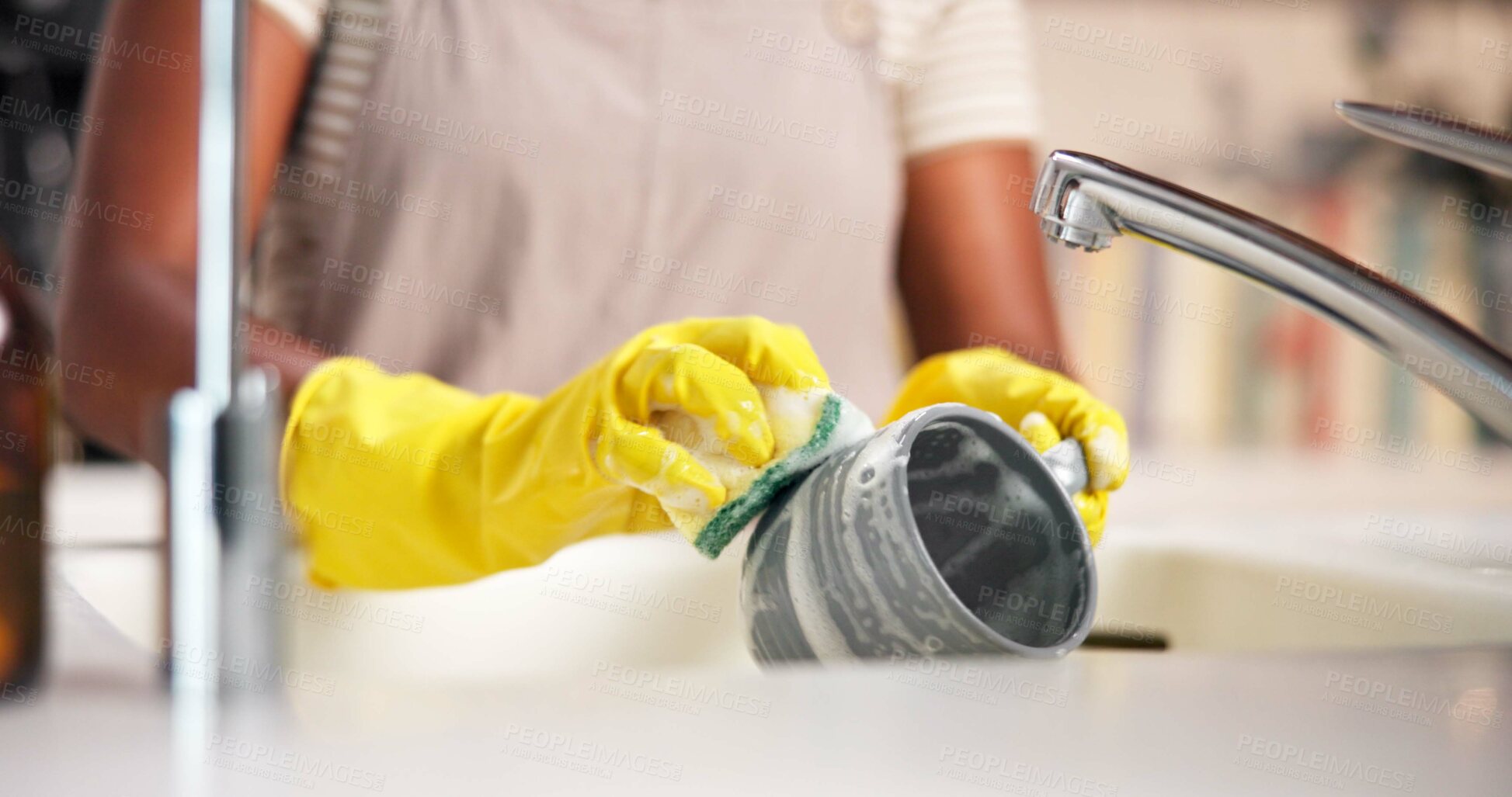 Buy stock photo Hands, washing dishes and soap with cup in kitchen for hygiene, gloves and stop bacteria by sink in home. Person, foam and cleaning mug with sponge for dirt, germs and routine by tap at apartment