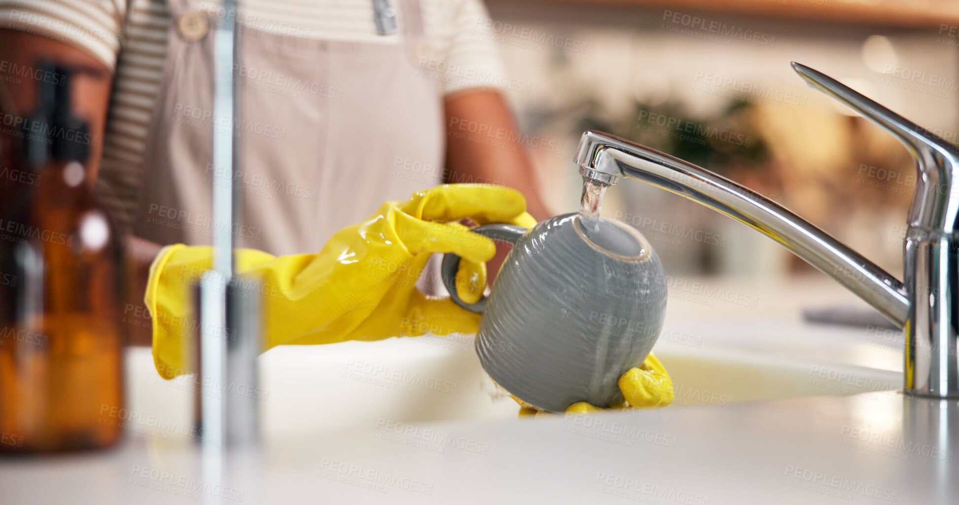 Buy stock photo Hands, washing dishes and faucet with cup in kitchen for hygiene, home and stop bacteria with gloves by sink. Person, water and cleaning mug for germs, virus and dirt by tap for routine at apartment
