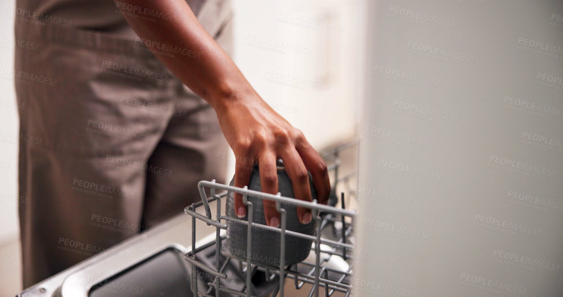 Buy stock photo Cleaning, hands and load dishwasher with cups for housekeeping service, domestic work or technology. Chores, kitchen or person with dishes in machine appliance for hygiene maintenance closeup in home