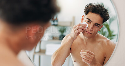 Buy stock photo Cotton pad, reflection and man in bathroom, skincare and confidence with routine, pride and cleanse. Person, house and guy with mirror, wellness and cosmetics with dermatology, grooming or beauty