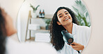 Mirror, woman and hair care with blow dryer for frizz control, heat treatment and smile for daily routine. Home, female person and wind with electric appliance for style, smooth texture and growth