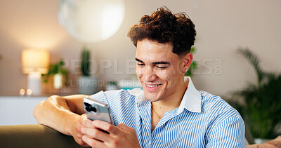 Buy stock photo Sofa, man and smile with smartphone for chat, online communication and connection with contact. Home, male person and cellphone for mobile application, social media and message on dating web in house