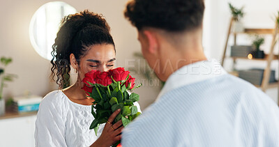 Buy stock photo Roses, smell or couple with gift for valentines day with love, support or scent for gratitude in home. Giving, celebrate or people with bouquet of flowers for romantic present, anniversary or bonding