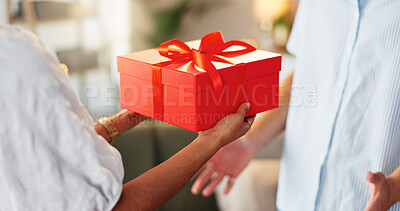 Buy stock photo Love, gift and romance with hands of couple for valentines day celebration, box or bonding. Relationship, care and surprise with man and woman at home for support, connection or present together